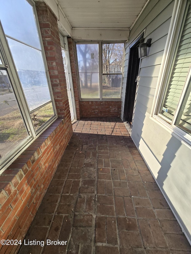 unfurnished sunroom with a wealth of natural light