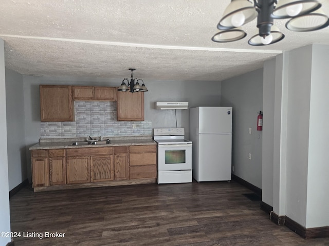 kitchen with sink, tasteful backsplash, dark hardwood / wood-style flooring, extractor fan, and white appliances