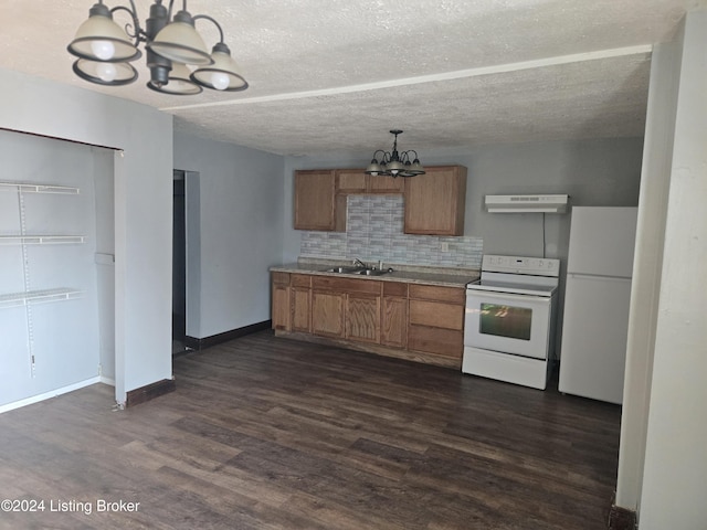 kitchen featuring white appliances, an inviting chandelier, dark hardwood / wood-style floors, tasteful backsplash, and extractor fan