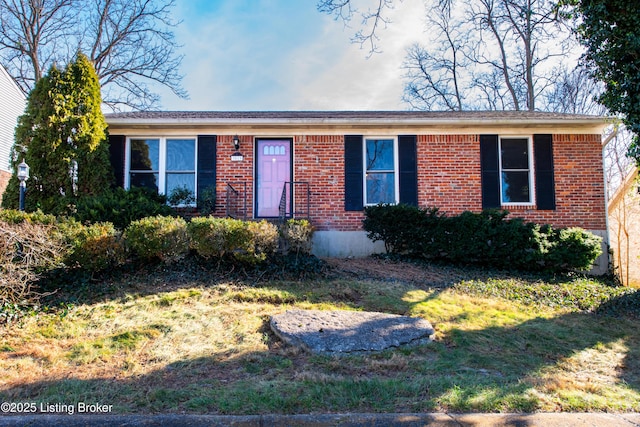 ranch-style home with a front lawn