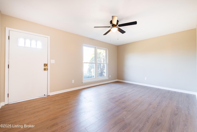 foyer with light hardwood / wood-style flooring and ceiling fan