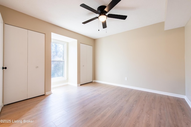 unfurnished bedroom featuring light hardwood / wood-style flooring and ceiling fan