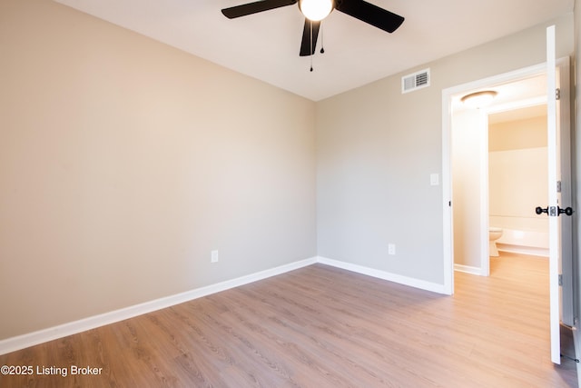 spare room with light hardwood / wood-style flooring and ceiling fan