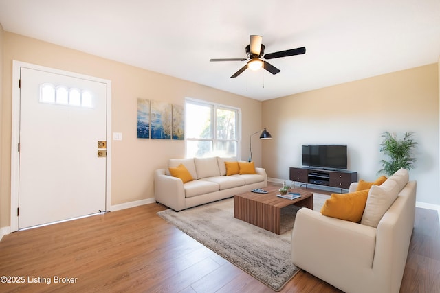 living room with hardwood / wood-style floors and ceiling fan