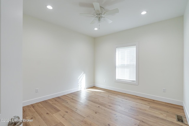 empty room featuring ceiling fan and light wood-type flooring