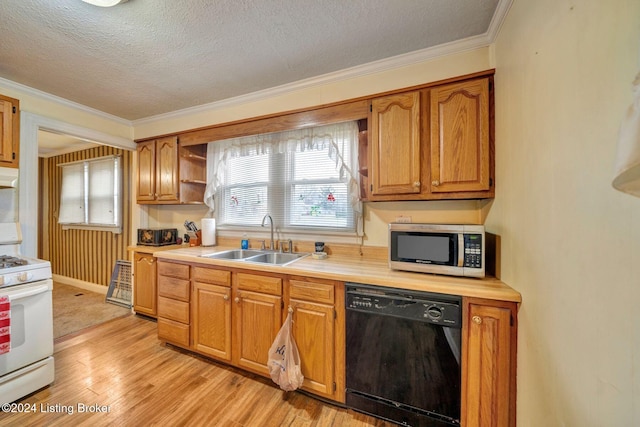 kitchen with dishwasher, sink, light hardwood / wood-style flooring, a textured ceiling, and white gas range oven