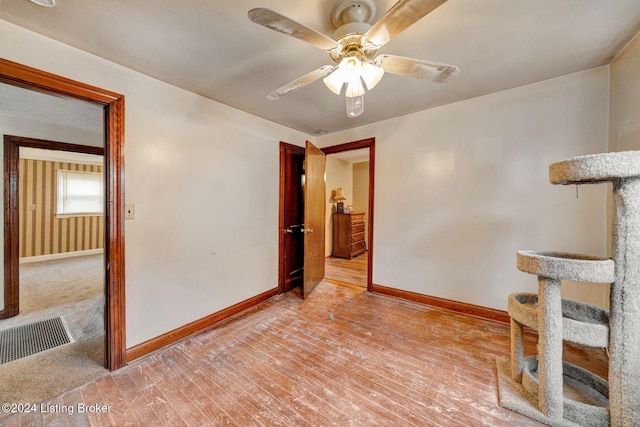 empty room featuring light hardwood / wood-style floors and ceiling fan