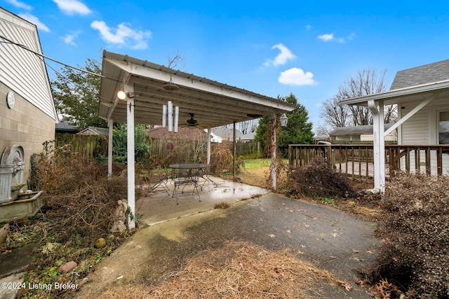 view of patio featuring ceiling fan