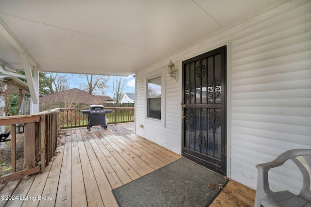 deck with a porch and grilling area