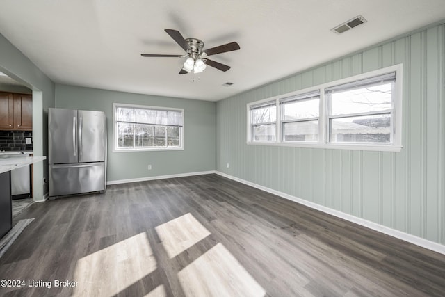 kitchen featuring decorative backsplash, stainless steel fridge, ceiling fan, and dark wood-type flooring