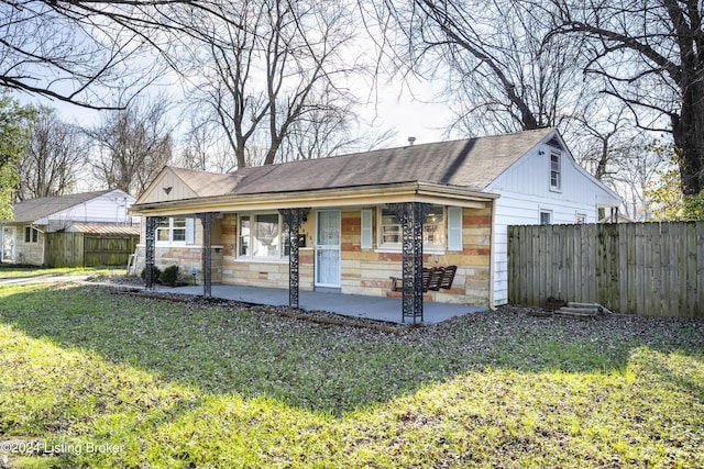 ranch-style house featuring a patio area and a front yard