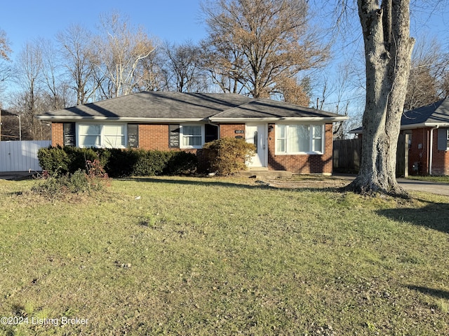 single story home with a front lawn