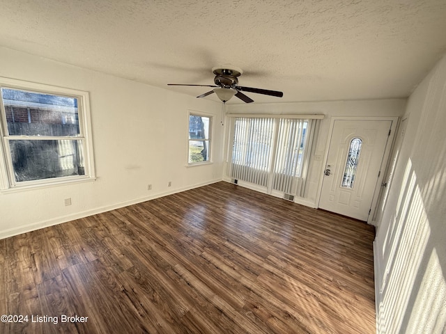 foyer featuring hardwood / wood-style floors, a textured ceiling, and ceiling fan