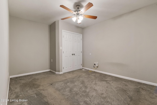 unfurnished bedroom featuring ceiling fan, carpet floors, and a closet