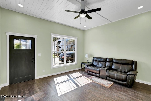 living room featuring plenty of natural light, ceiling fan, and dark hardwood / wood-style flooring