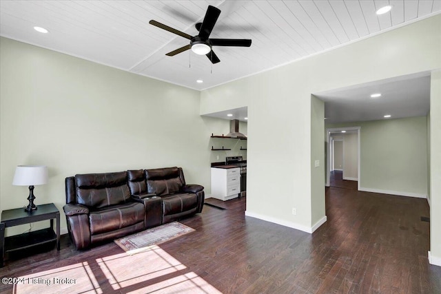 living room with ceiling fan, dark hardwood / wood-style flooring, and wood ceiling