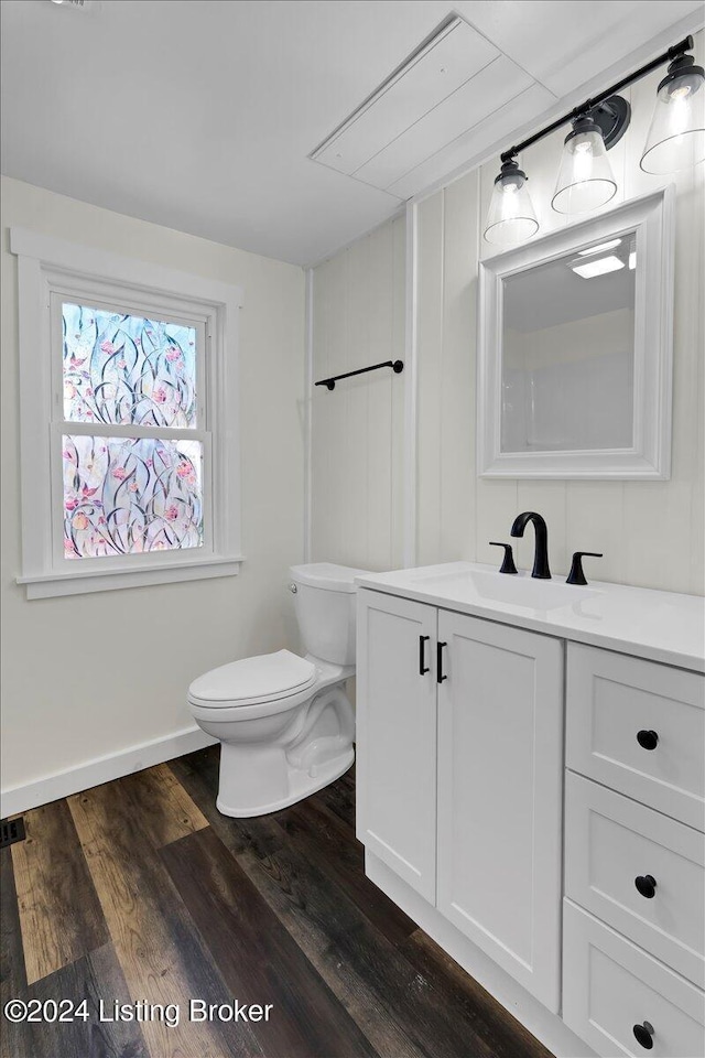 bathroom featuring hardwood / wood-style floors, vanity, and toilet