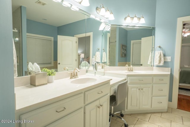 bathroom featuring tile patterned floors and vanity