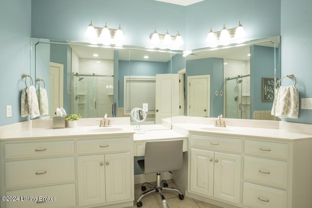 bathroom featuring tile patterned flooring, vanity, and a shower with shower door