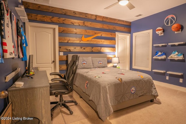 bedroom featuring light carpet and ceiling fan