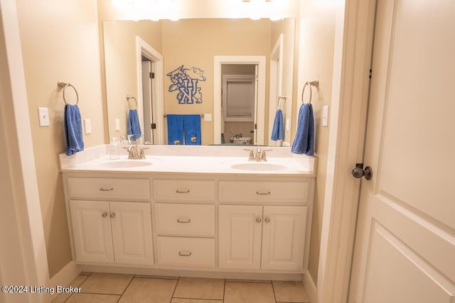 bathroom with tile patterned floors and vanity