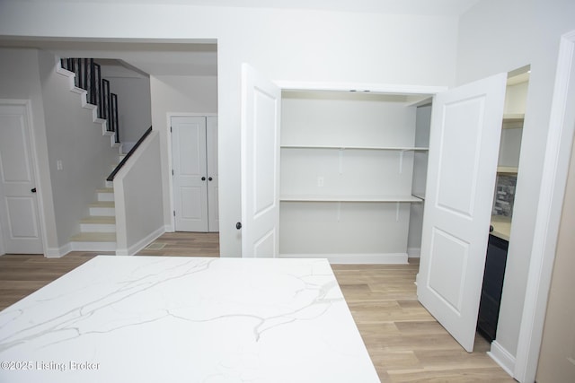 bedroom with light wood-type flooring