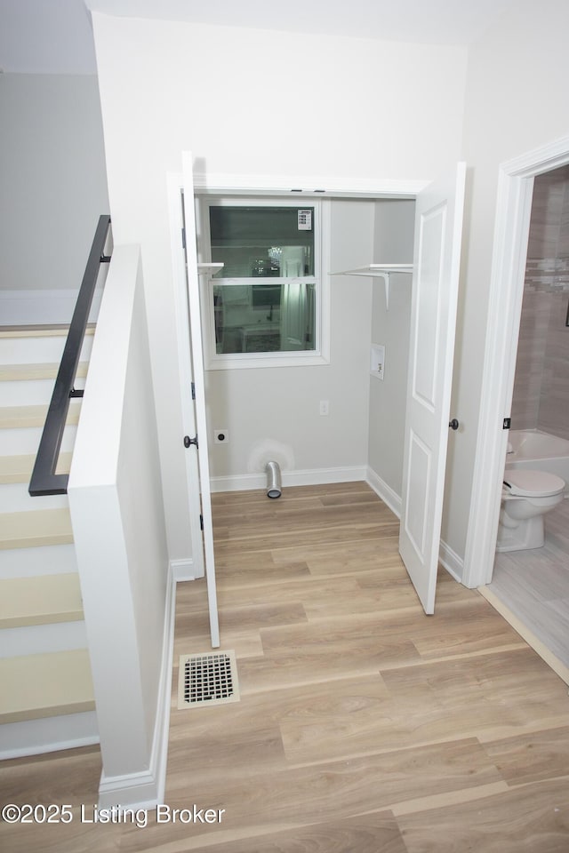 laundry room featuring light hardwood / wood-style floors