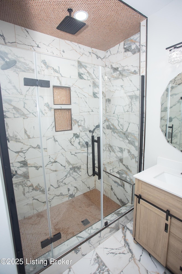 bathroom with vanity and walk in shower