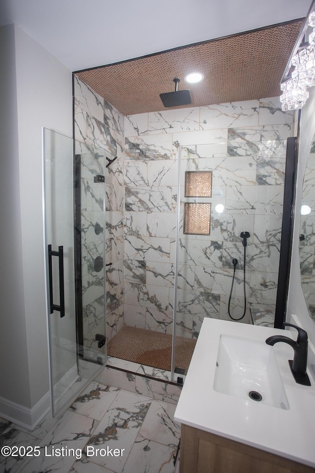 bathroom with vanity and a shower with shower door