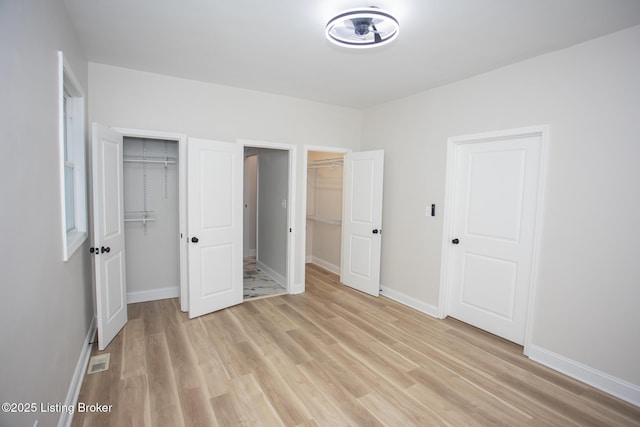 unfurnished bedroom featuring light wood-type flooring