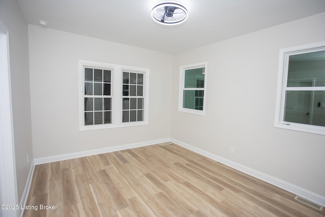 empty room with light hardwood / wood-style floors