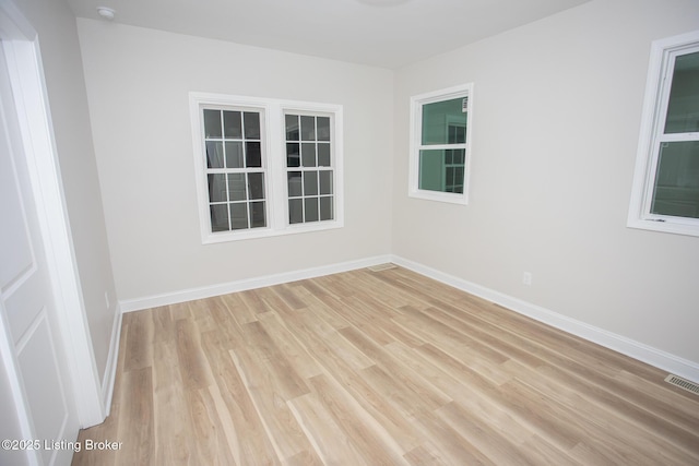 unfurnished room with light hardwood / wood-style flooring