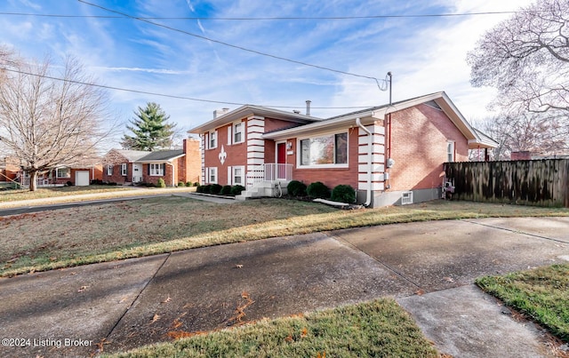 view of side of property featuring a yard