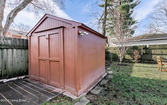 view of outbuilding with a lawn