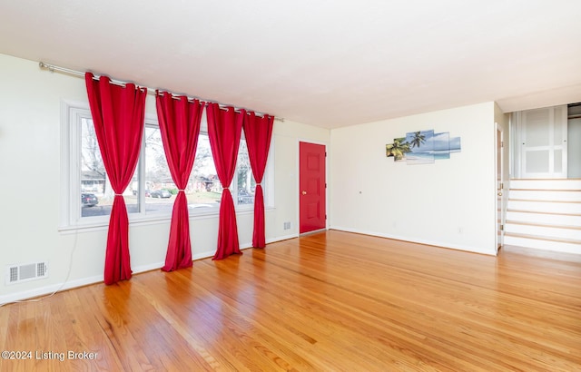 unfurnished room featuring wood-type flooring