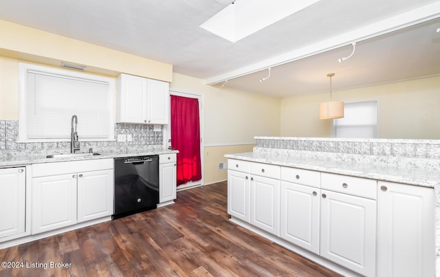 kitchen with rail lighting, sink, dishwasher, white cabinetry, and hanging light fixtures