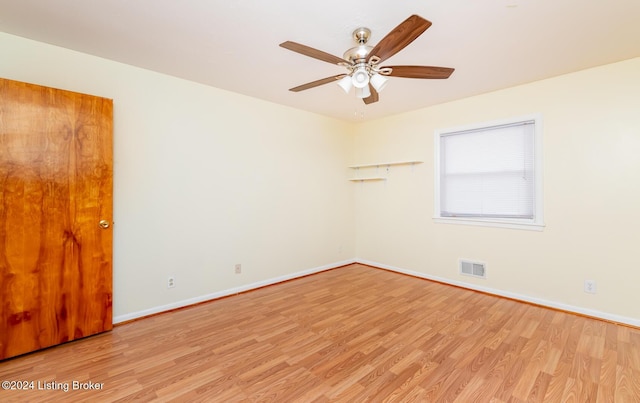 spare room featuring ceiling fan and light hardwood / wood-style floors