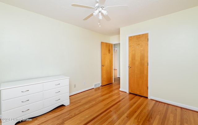 unfurnished bedroom with light hardwood / wood-style flooring and ceiling fan