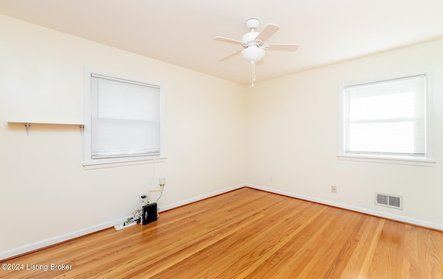 spare room featuring ceiling fan and hardwood / wood-style flooring