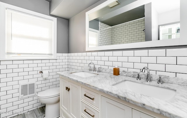 bathroom featuring backsplash, hardwood / wood-style floors, toilet, vanity, and tile walls