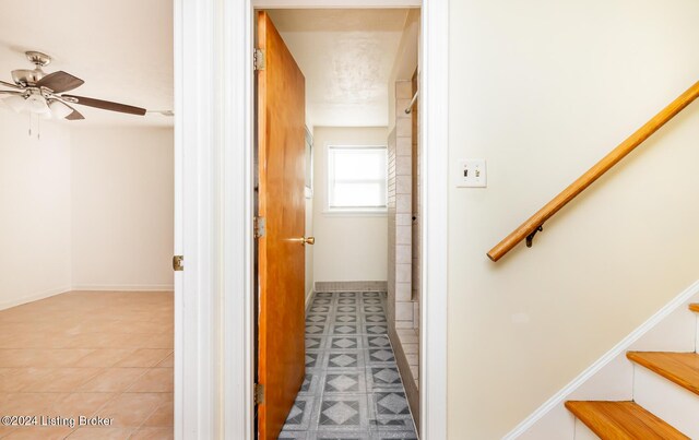 hall featuring tile patterned flooring