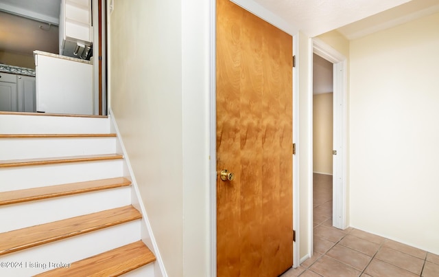 staircase with tile patterned flooring