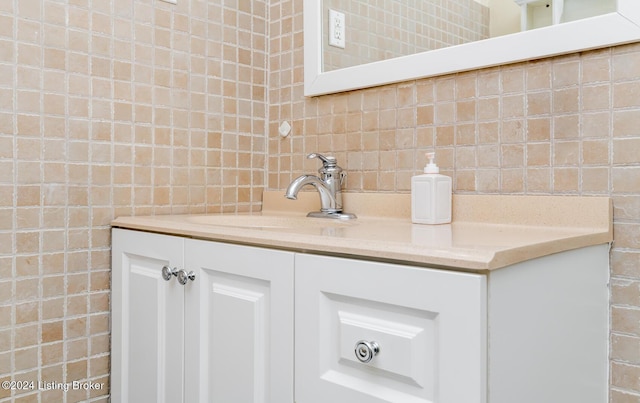 interior details with decorative backsplash and vanity