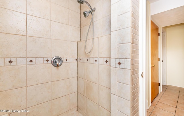 bathroom featuring tile patterned floors and tiled shower