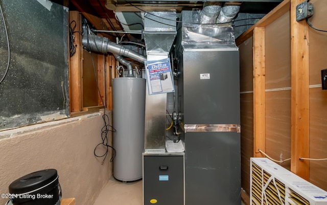 utility room with heating unit and water heater