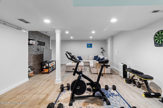 exercise area featuring hardwood / wood-style flooring