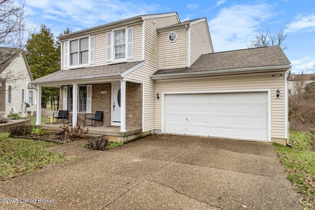 view of front of home with covered porch and a garage