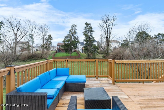 wooden deck featuring a yard and an outdoor hangout area