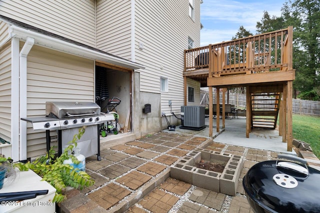 view of patio / terrace featuring a grill and central air condition unit