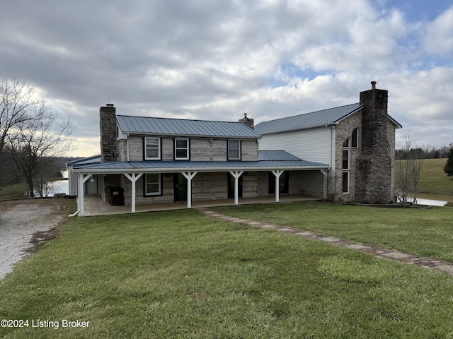 farmhouse with a front yard and covered porch